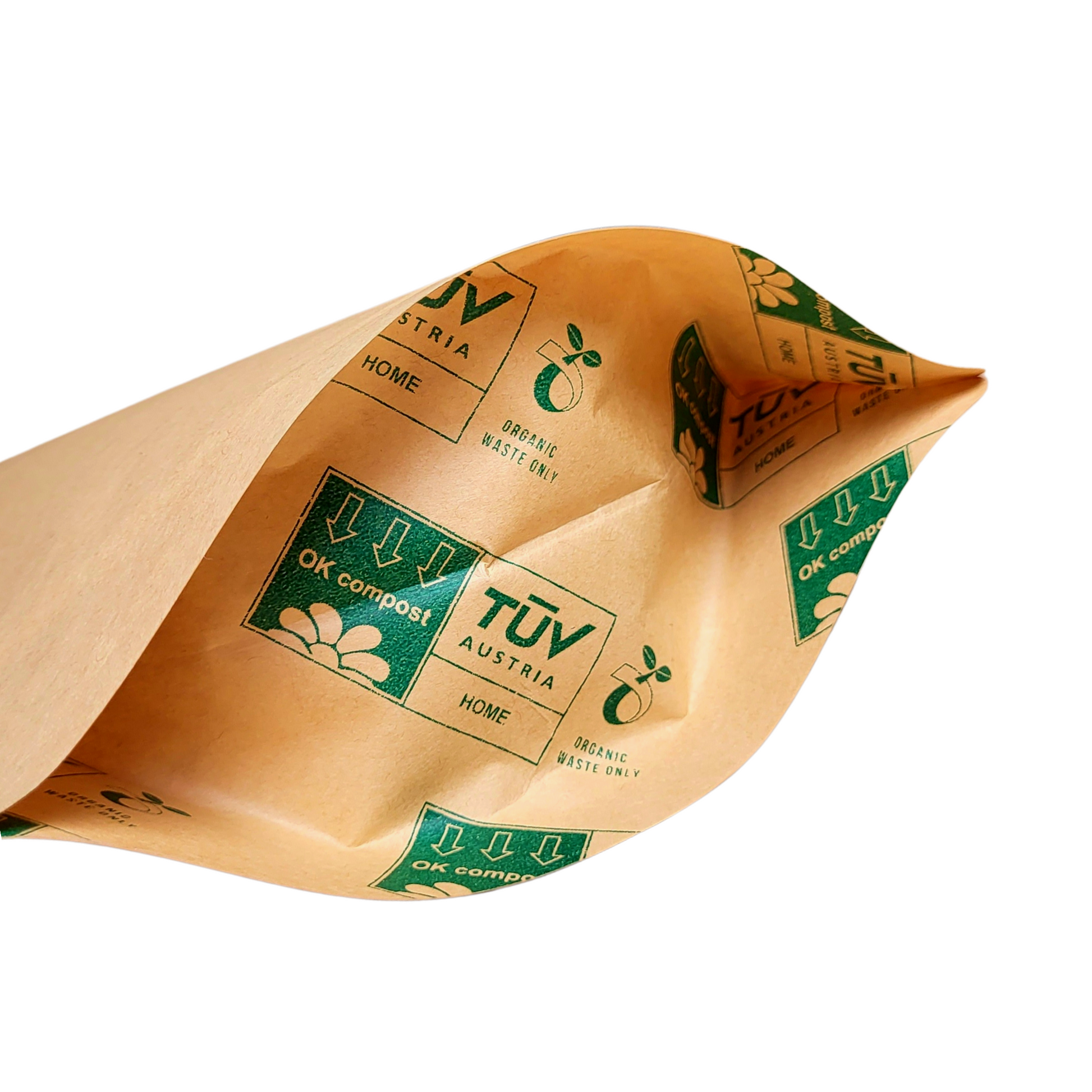 Compostable doypack made of kraft paper and bioplastic. Packaging designed for home composting.