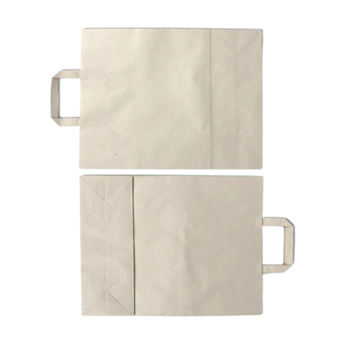 Grass paper bags with flat handles. Shopping bags in beige.